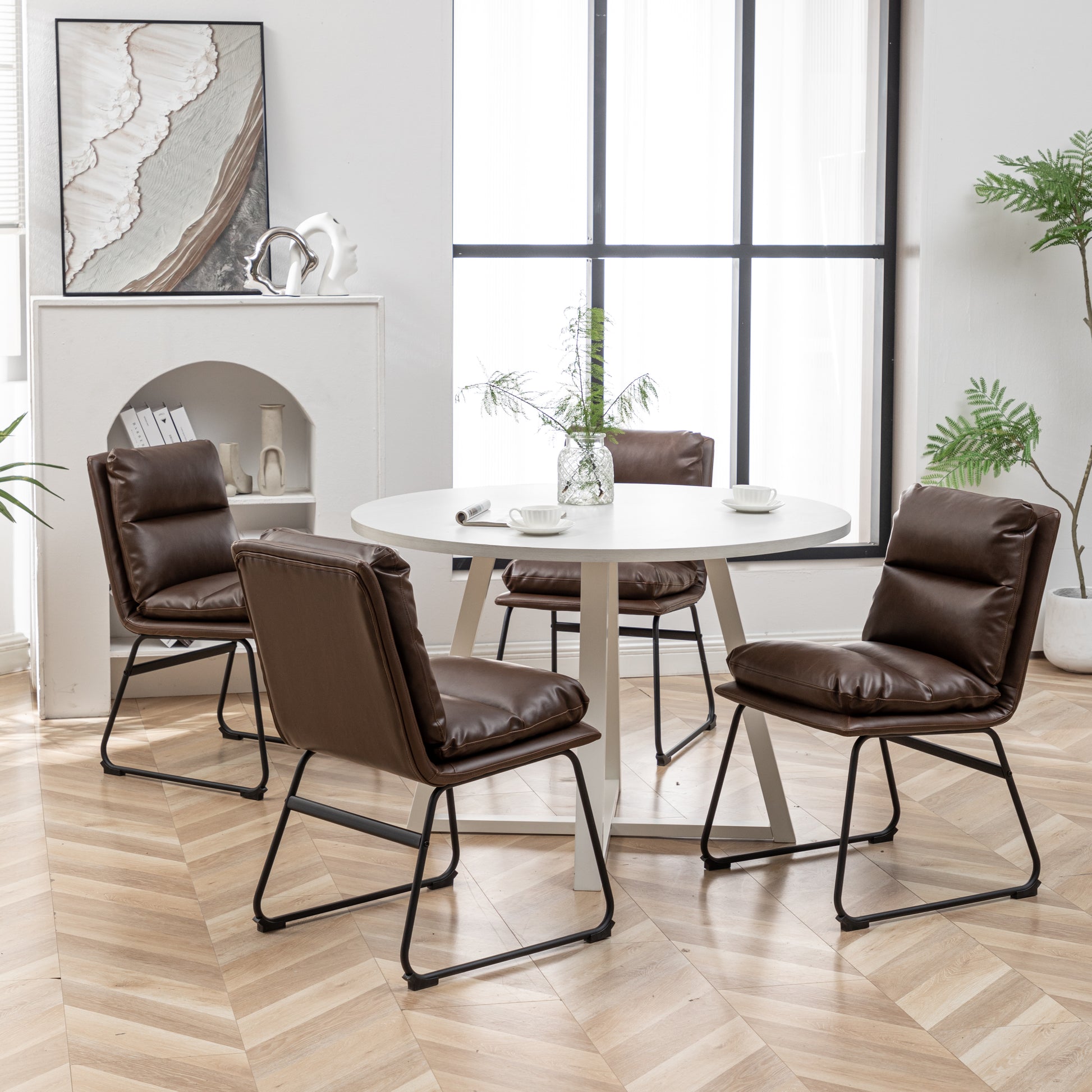 Brown faux leather dining chair with tufted back and black metal legs