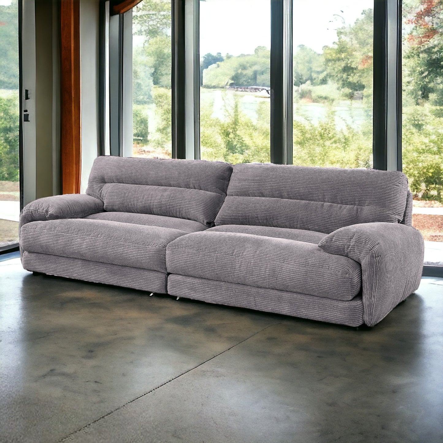 Plush gray corduroy sofa with comfortable deep seats and wide arms perfect for modern living