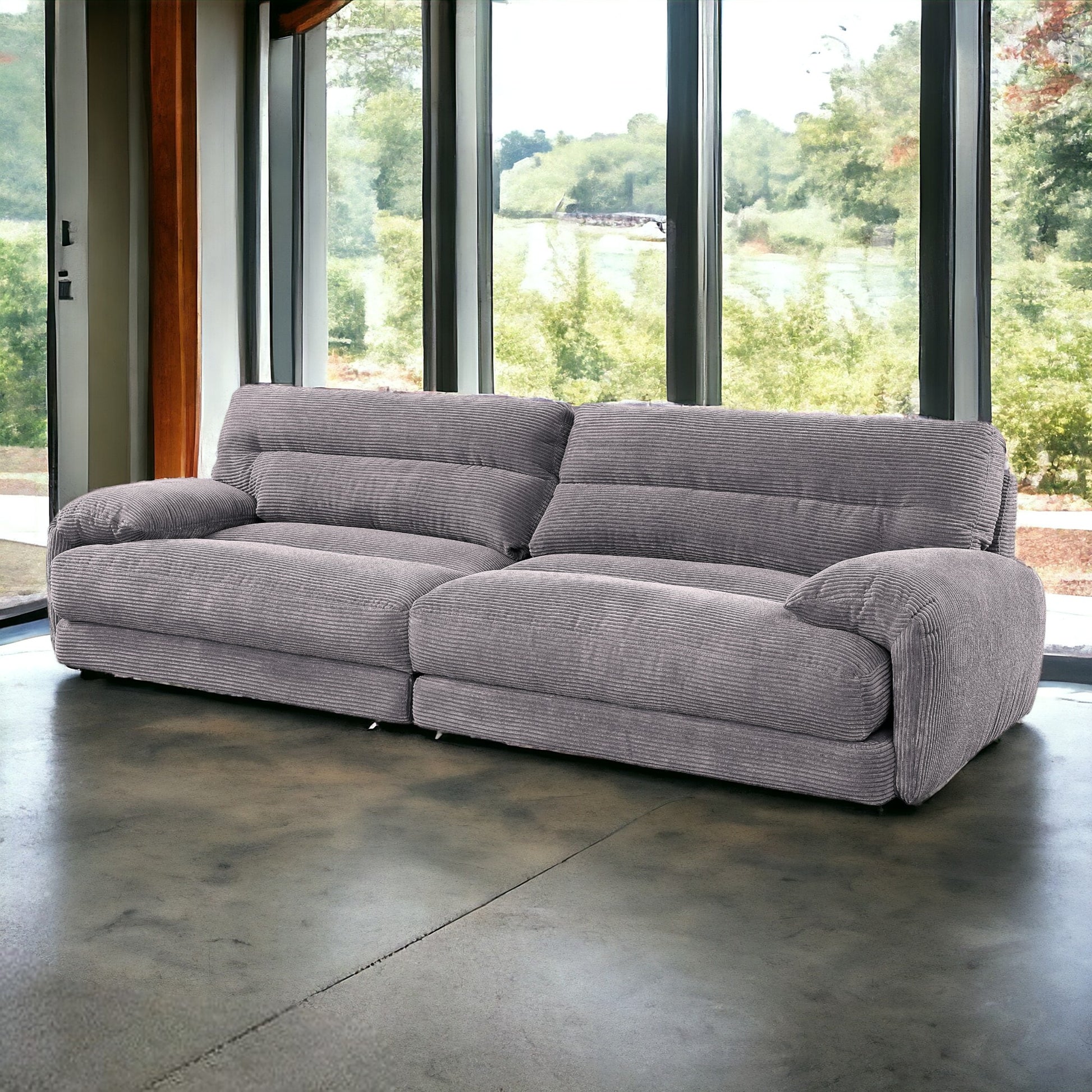 Plush gray corduroy sofa with comfortable deep seats and wide arms perfect for modern living