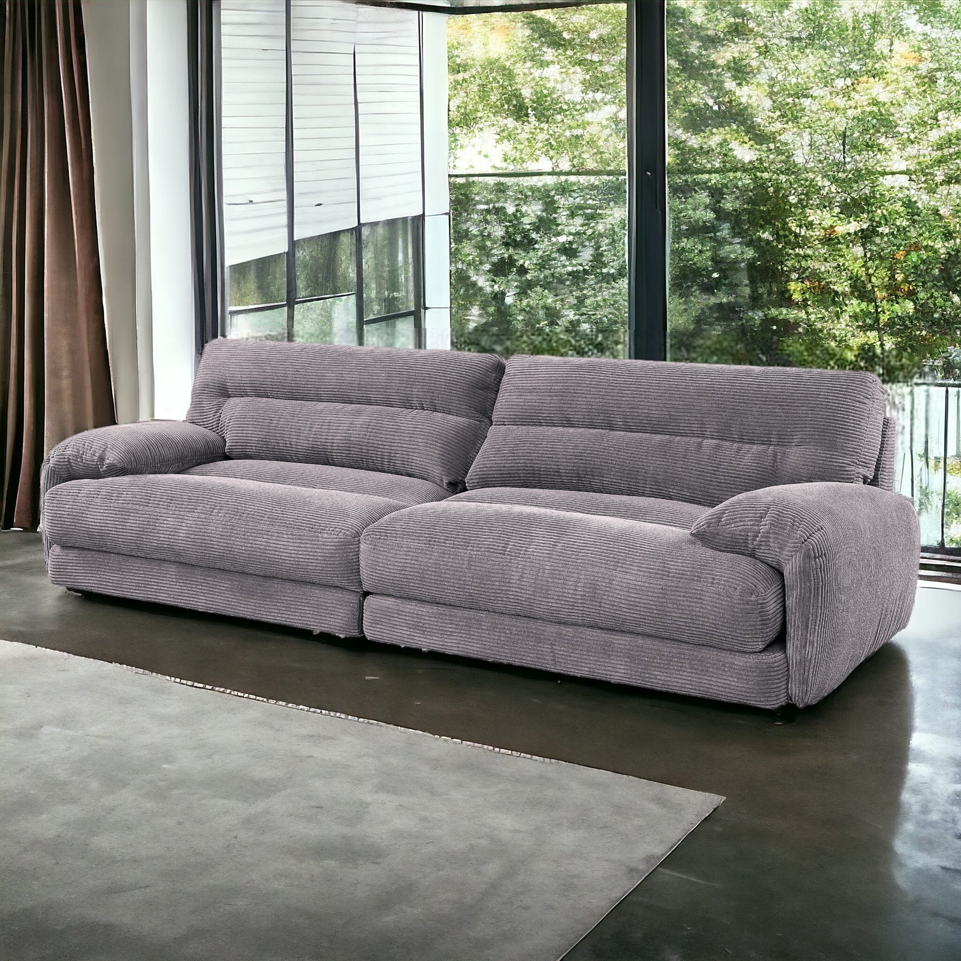 Plush grey corduroy sofa with deep seats and channel tufting ideal for modern living rooms