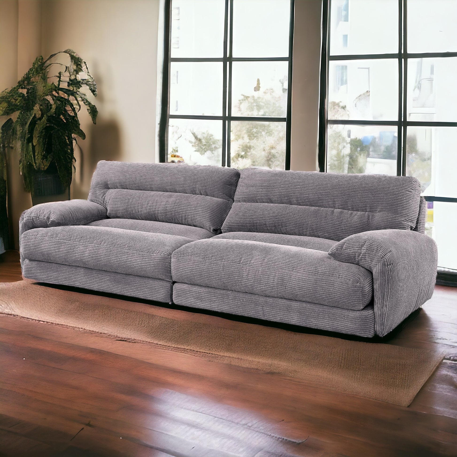 Plush gray corduroy sofa with wide cushions perfect for a cozy living room