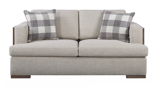 Twoseater modern sofa in beige fabric with plaid accent pillows and dark wood trim