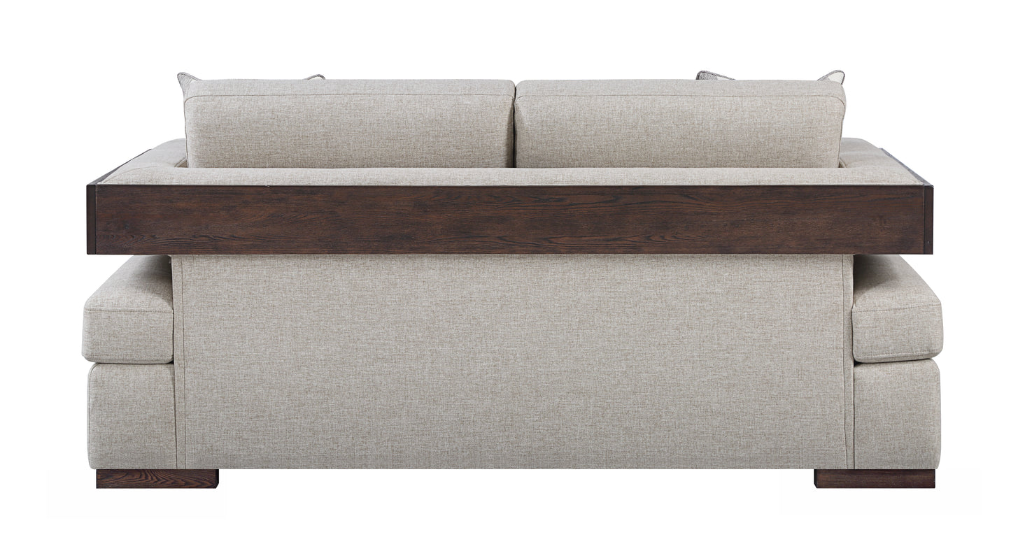 Modern light beige fabric sofa with dark wood accent panel and legs