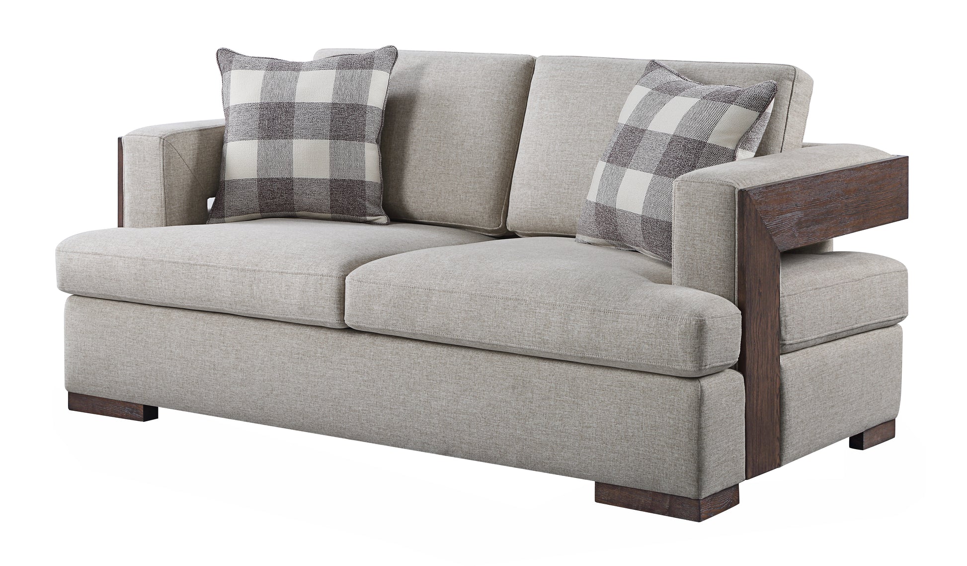 A contemporary beige sofa with dark wood arm accents and buffalo plaid accent pillows