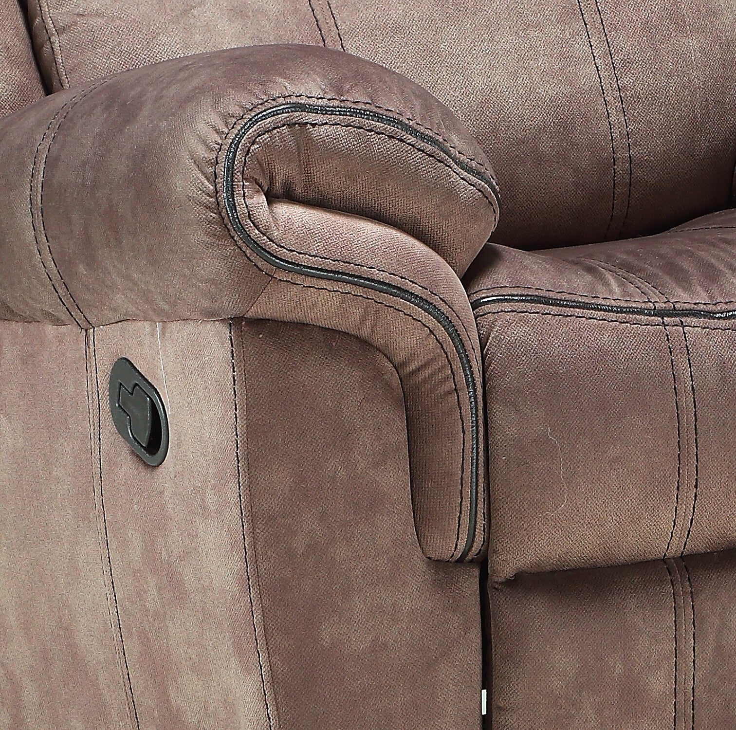 Closeup of a brown recliner sofa armrest with detailed stitching and a lever mechanism