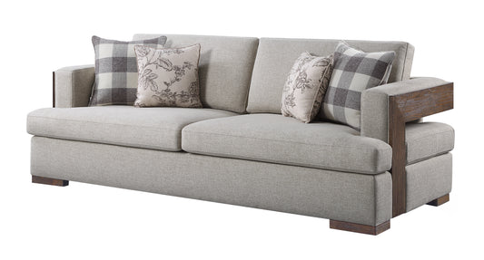 Light gray upholstered couch with wood accents and decorative pillows perfect for a living room