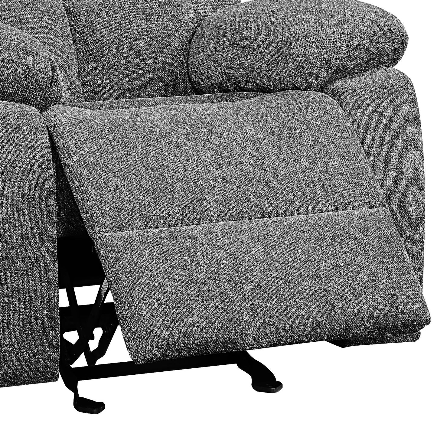 Closeup of a grey fabric recliner with the footrest partially extended showing metal mechanism