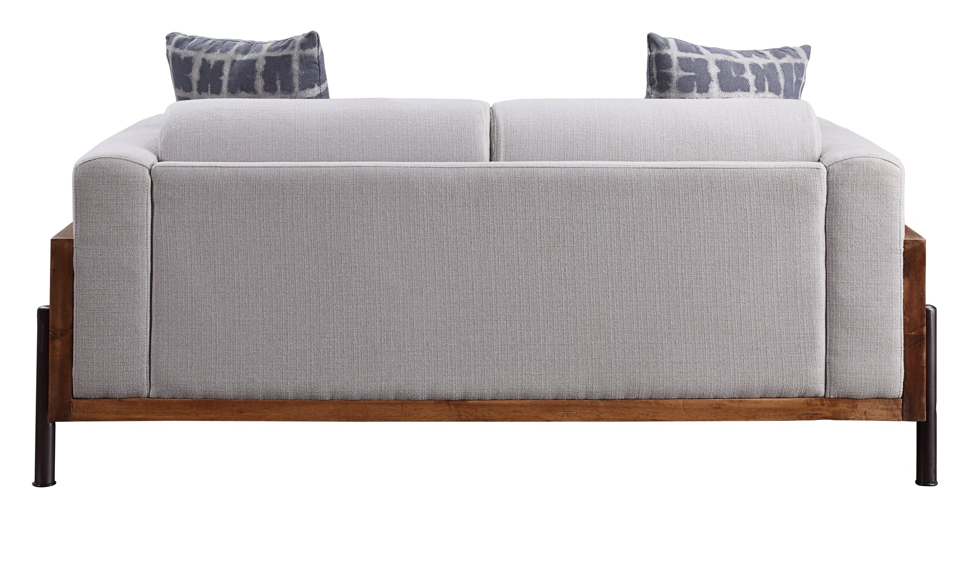 Light grey fabric sofa with geometric print pillows and dark wood frame