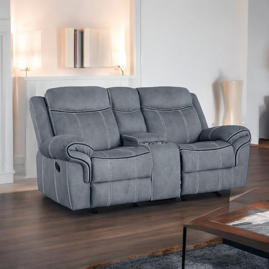 Gray reclining loveseat with white stitching and builtin cup holders