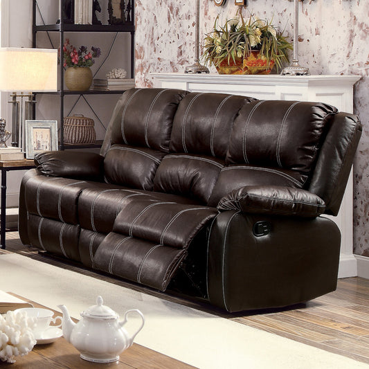 Dark brown leather recliner sofa with white stitching and plush cushions for ultimate comfort