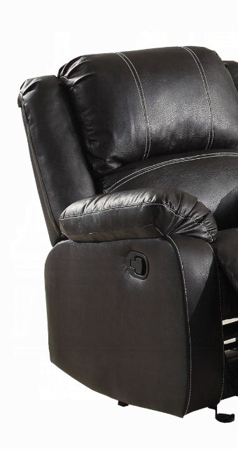 Black faux leather recliner chair with white stitching detail and side lever