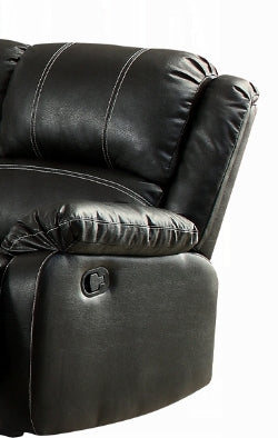 Closeup of a black faux leather recliner armrest with white stitching detail and lever