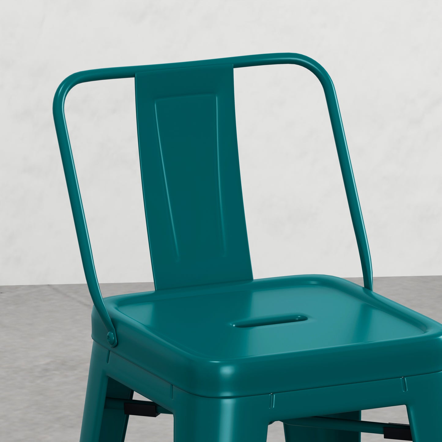 Teal metal bistro chair with a rounded back and seat perfect for cafes
