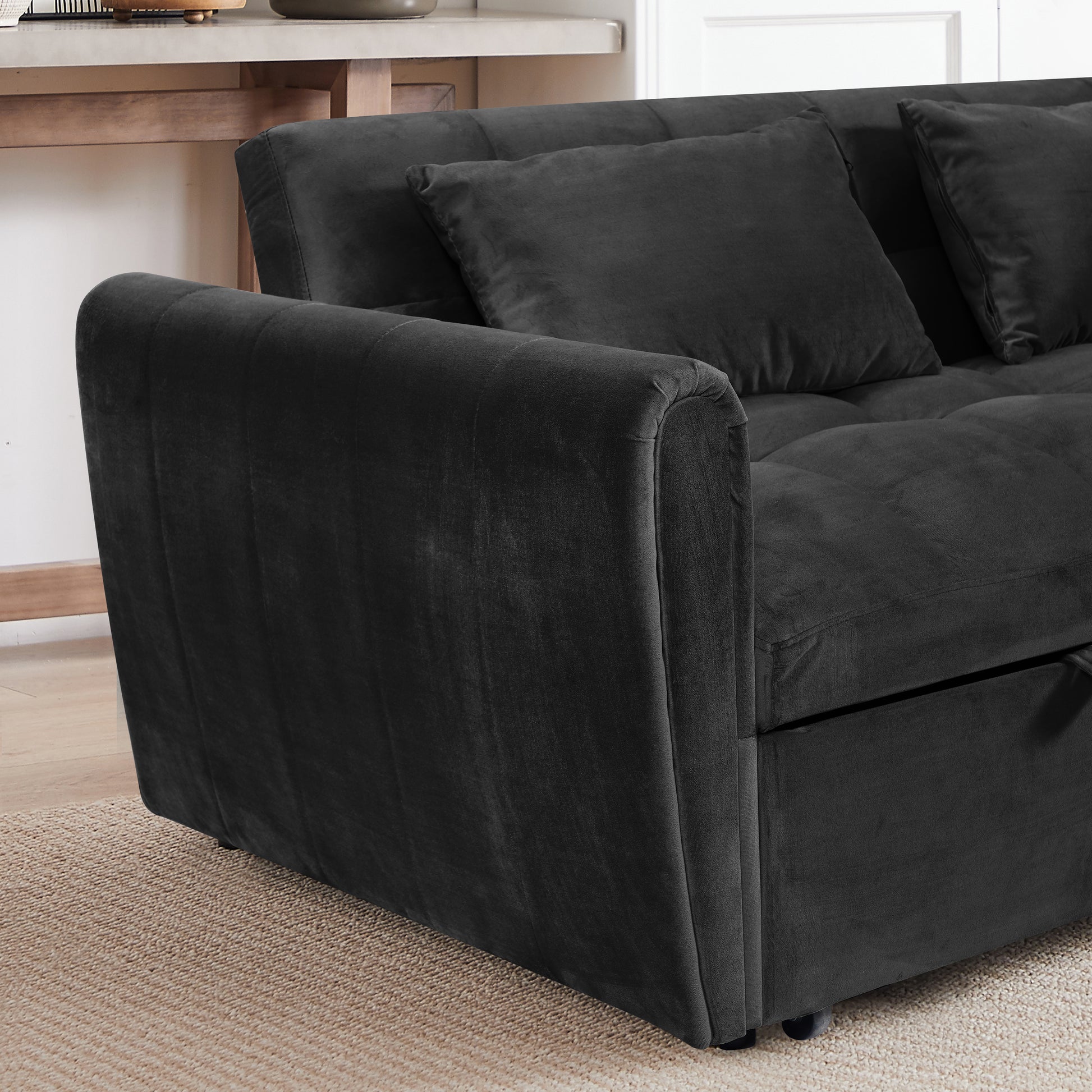Deep charcoal velvet sofa with plush throw pillows ideal for modern living rooms