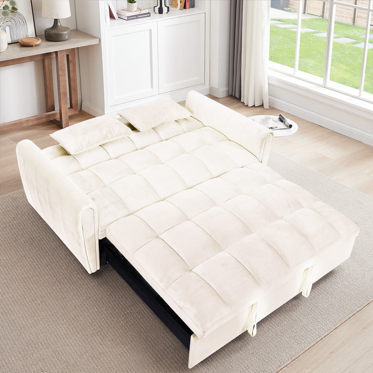 Cream velvet sofa bed with tufted cushions and pullout frame