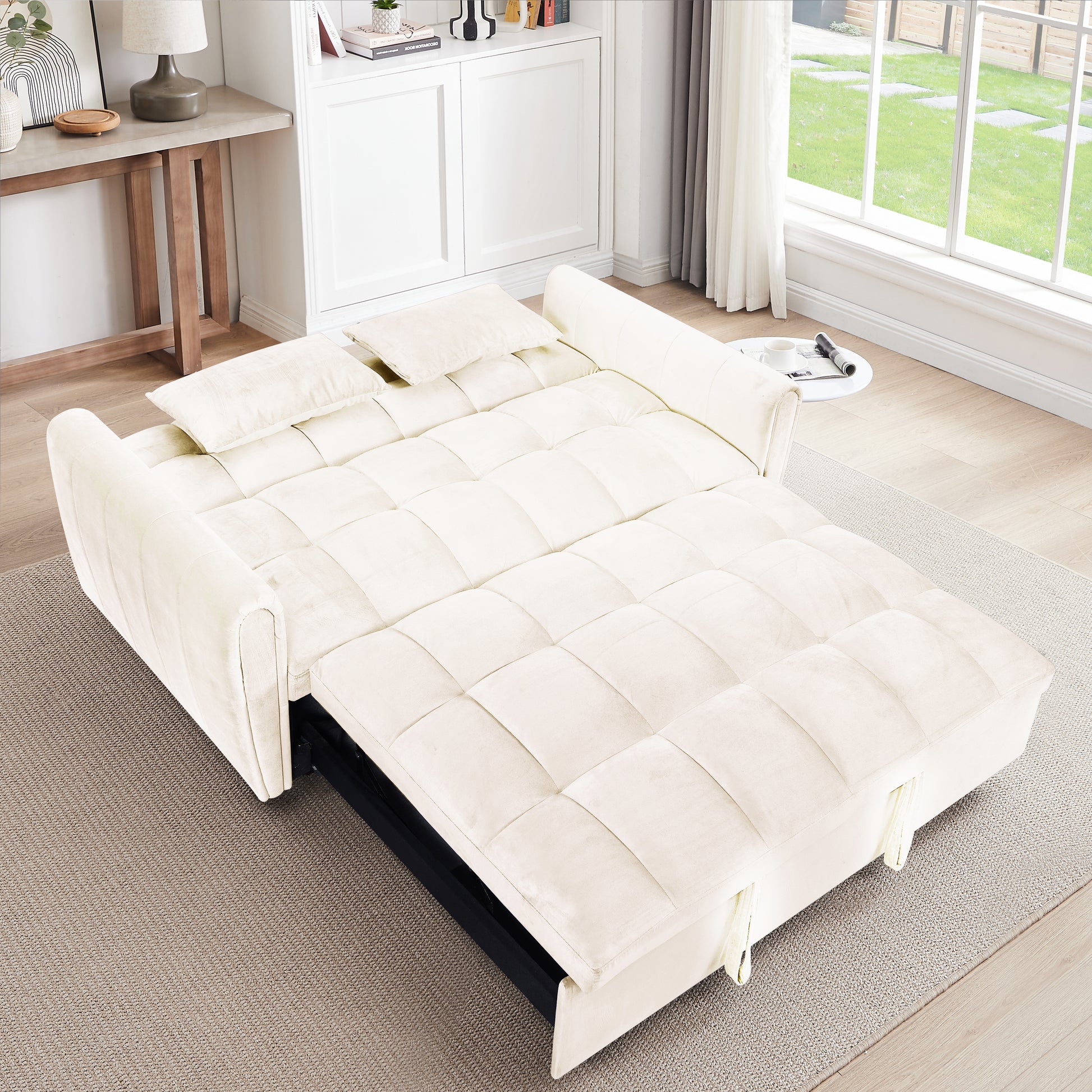Cream velvet sofa bed with tufted cushions and pullout frame