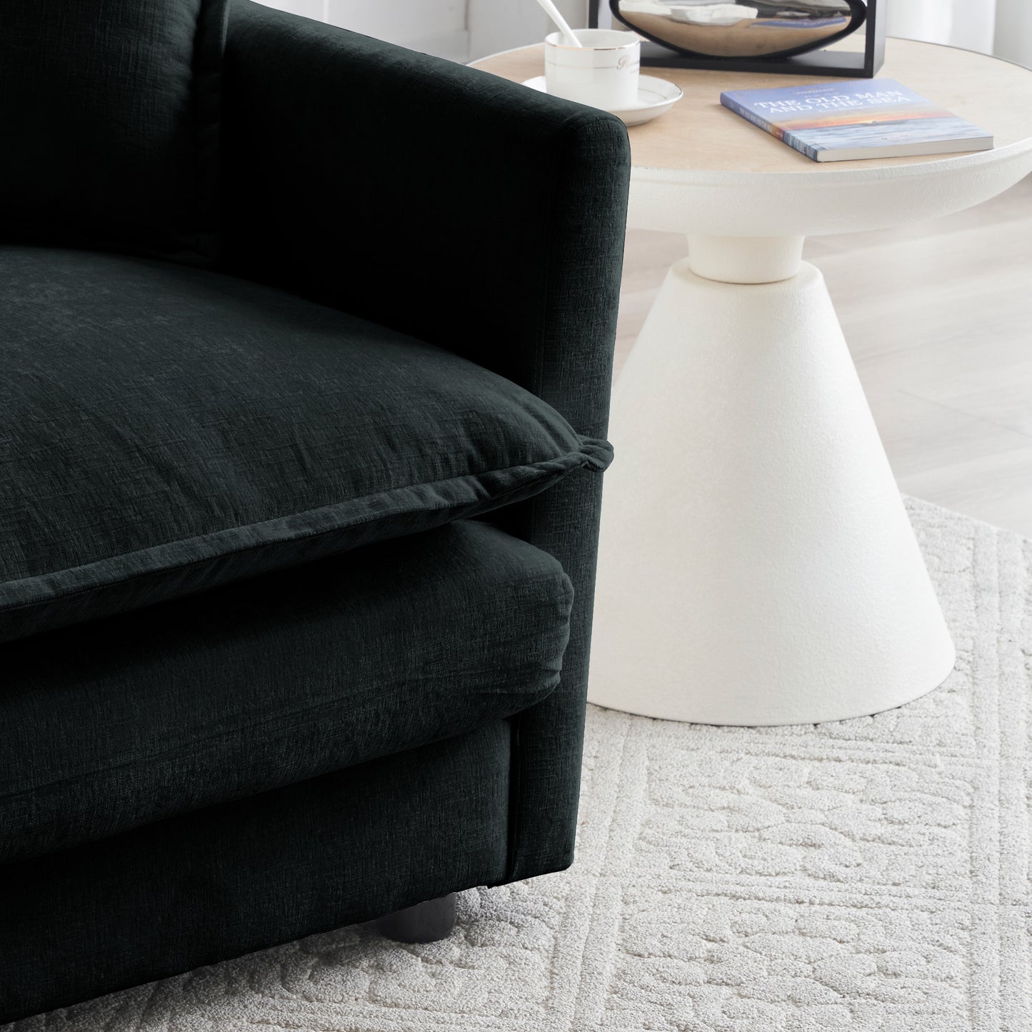 Plush dark grey velvet armchair with deep seat cushion and textured fabric