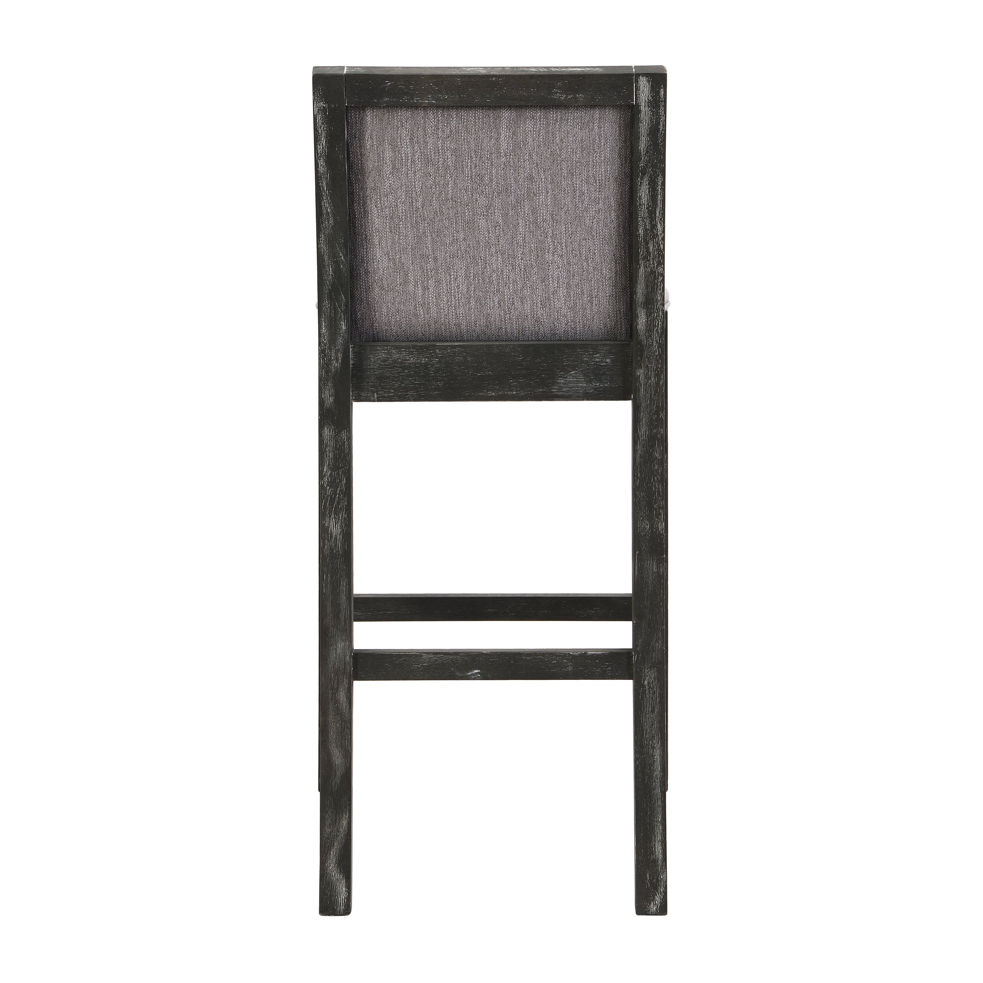 Back view of a distressed dark gray wooden bar stool with a textured gray fabric seat