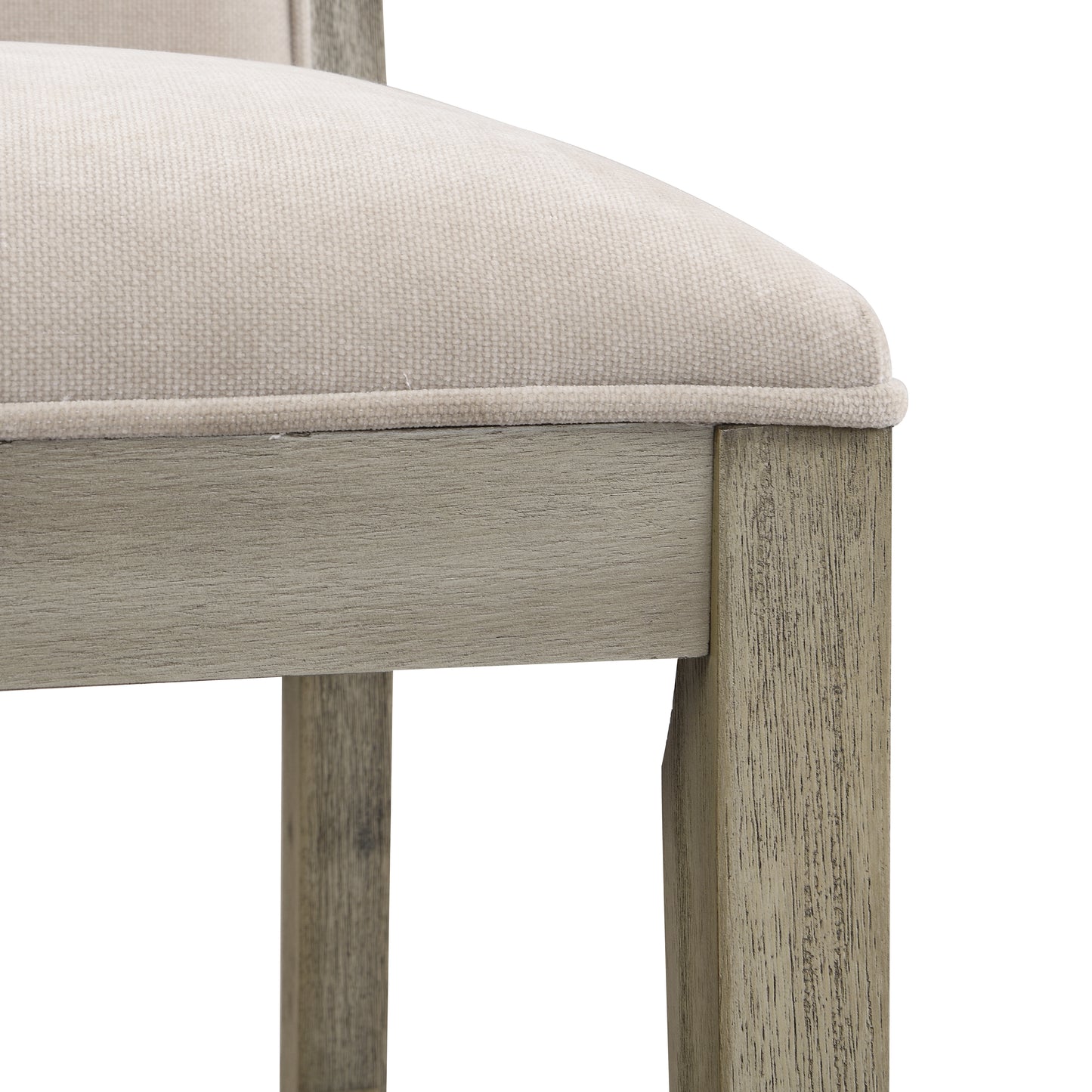 Close up of textured beige fabric seat cushion and distressed gray wood chair frame