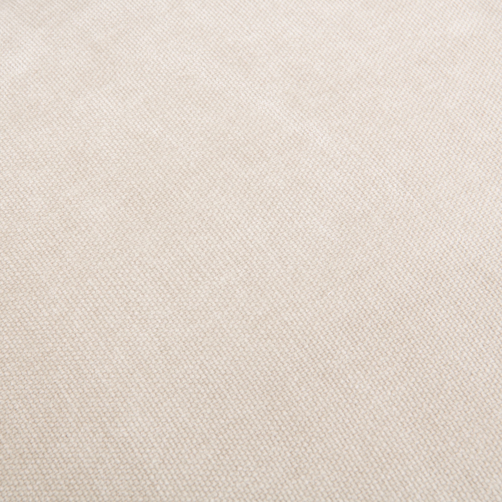 Closeup of woven beige fabric texture with a subtle diamond pattern perfect for upholstery