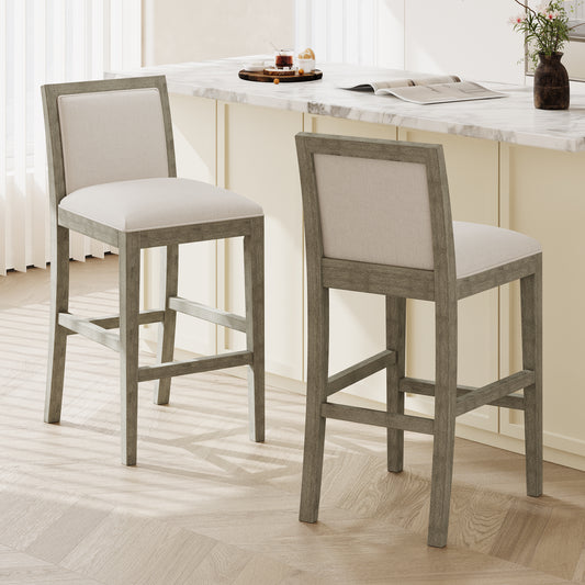 Two light gray wood and cream upholstered bar stools with plush seating for modern kitchens
