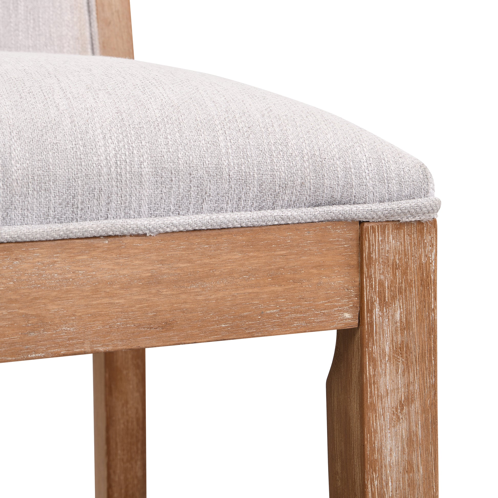 Textured light gray fabric seat on distressed wood dining chair