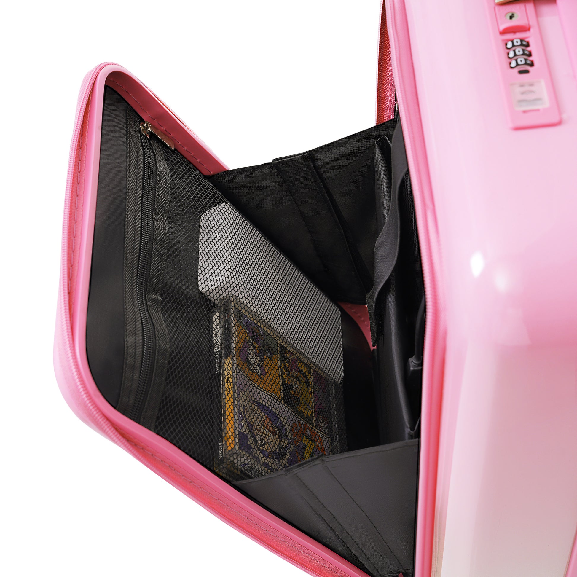 Open pink suitcase interior with mesh pockets holding graphic novels