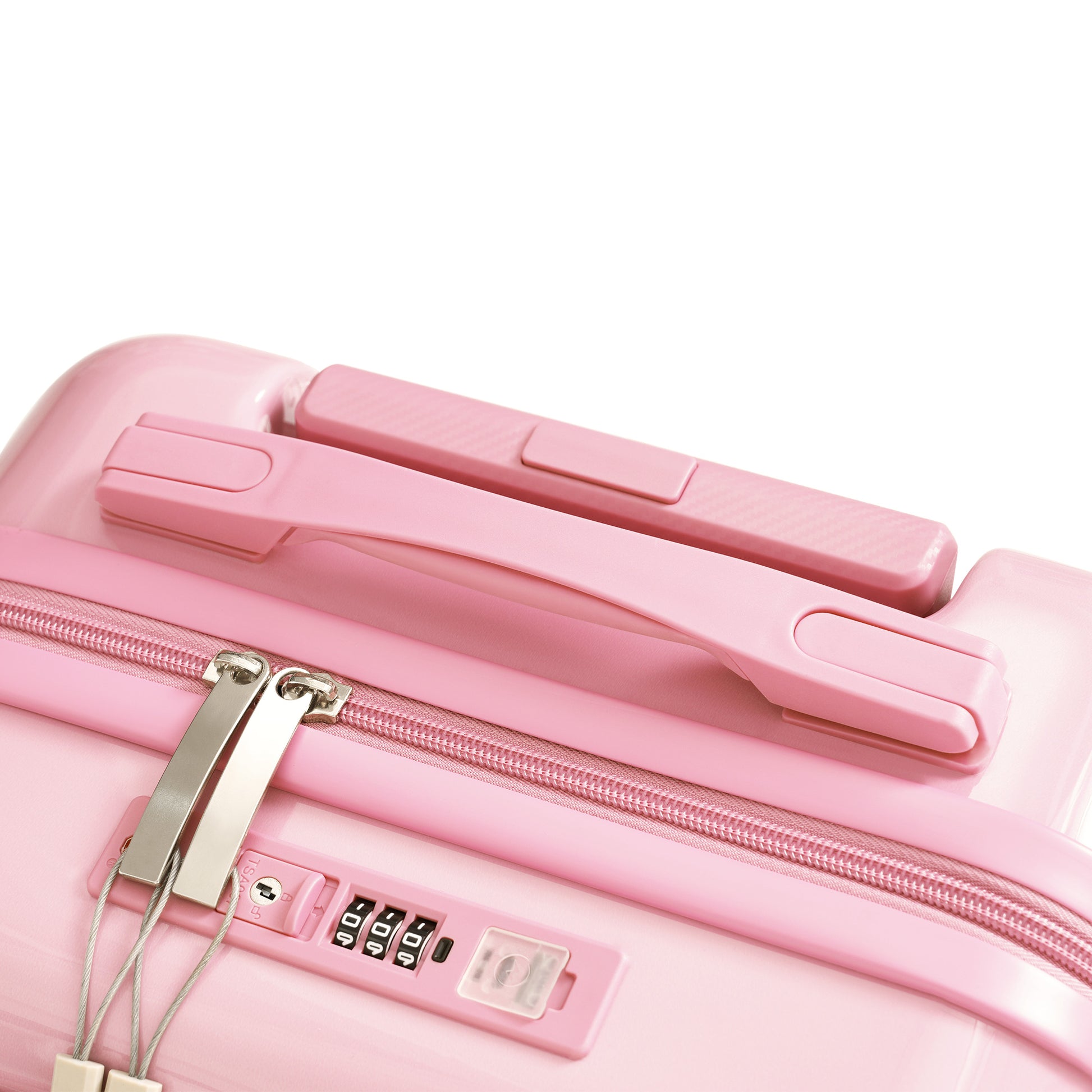 Closeup of pink polycarbonate suitcase with combination lock and handle