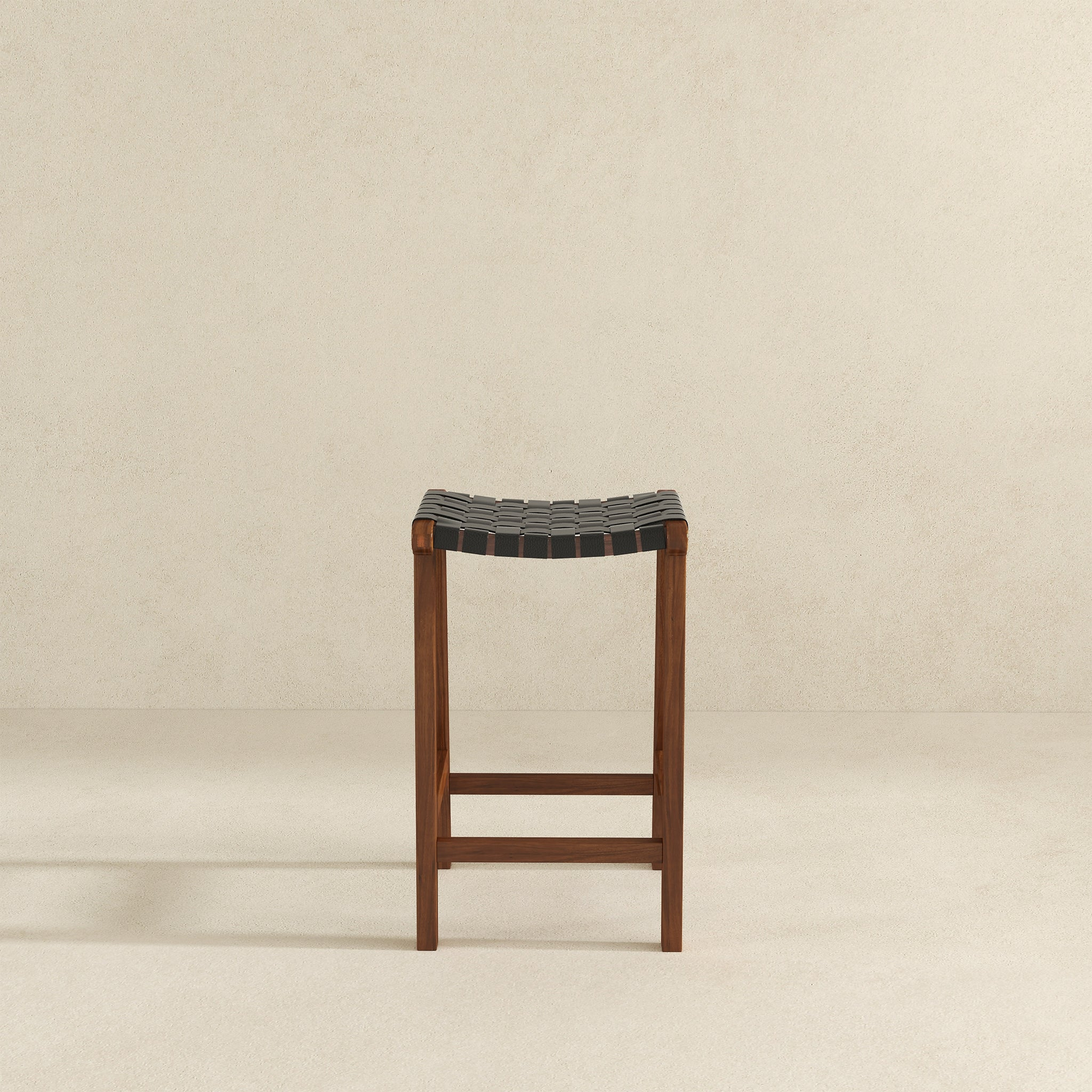 Dark wood and black leather woven counter stool with a minimalist design