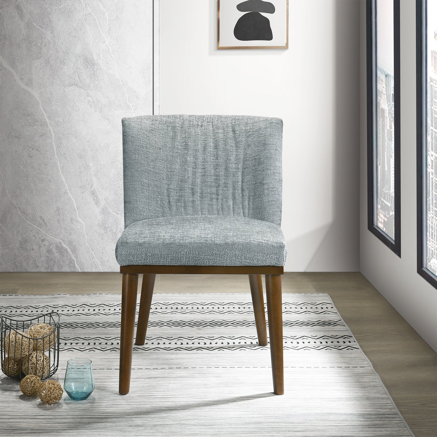 Upholstered dining chair with light blue textured fabric and tapered wooden legs