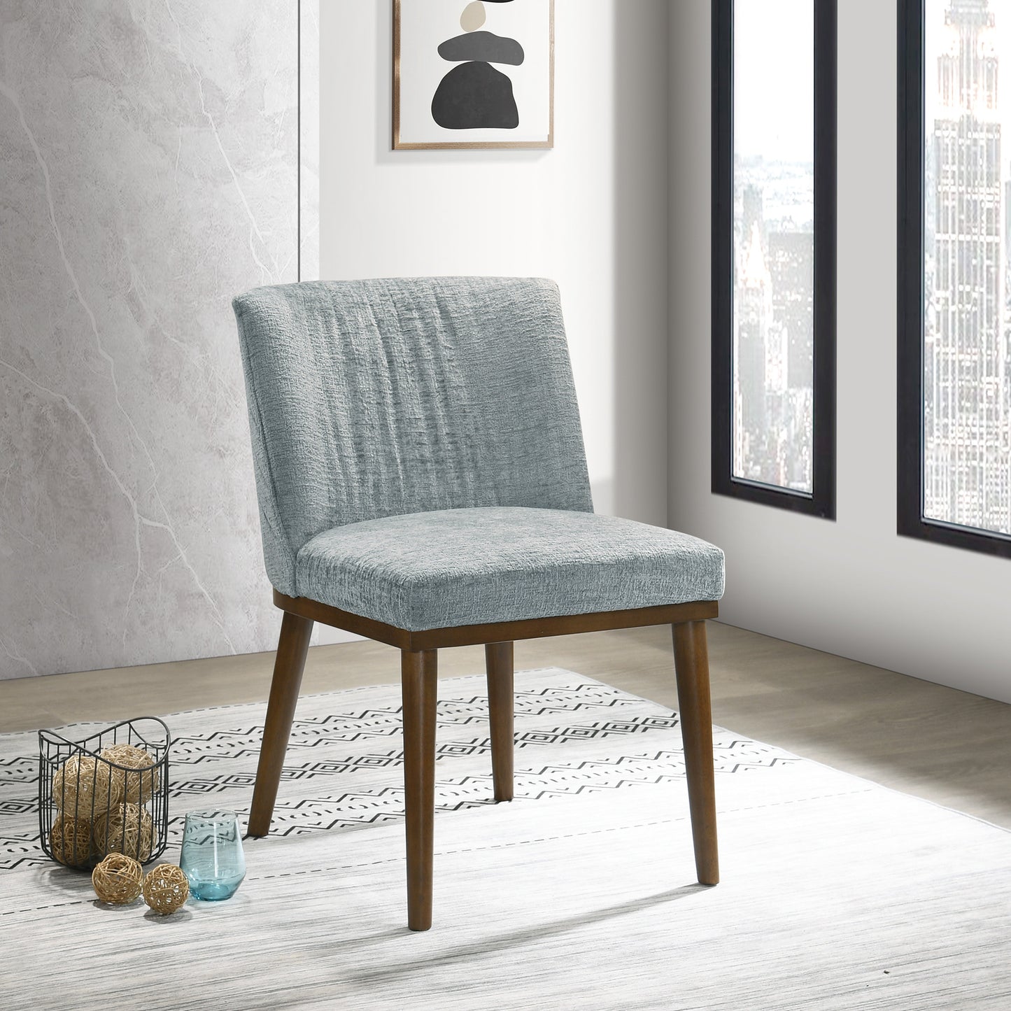 Light blue textured fabric accent chair with tapered walnut legs ideal for modern dining
