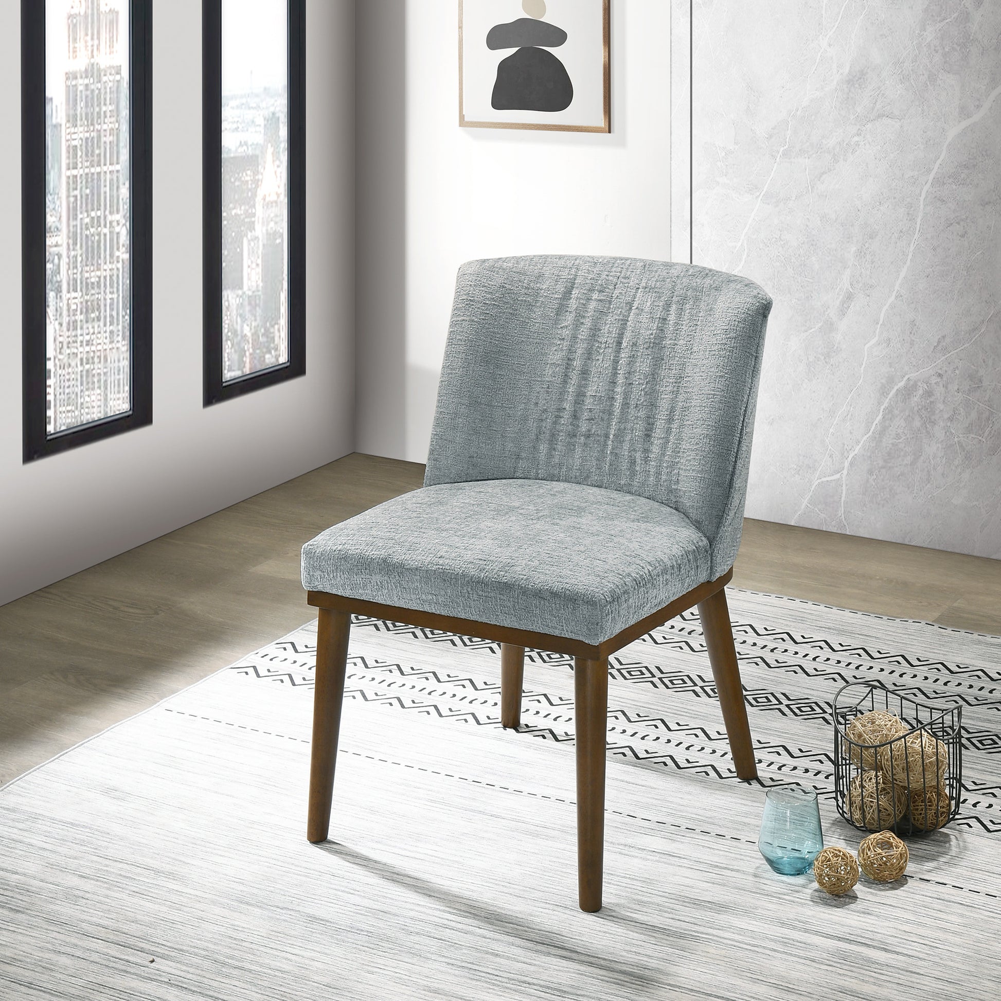 Light blue fabric dining chair with natural wood legs perfect for modern kitchens