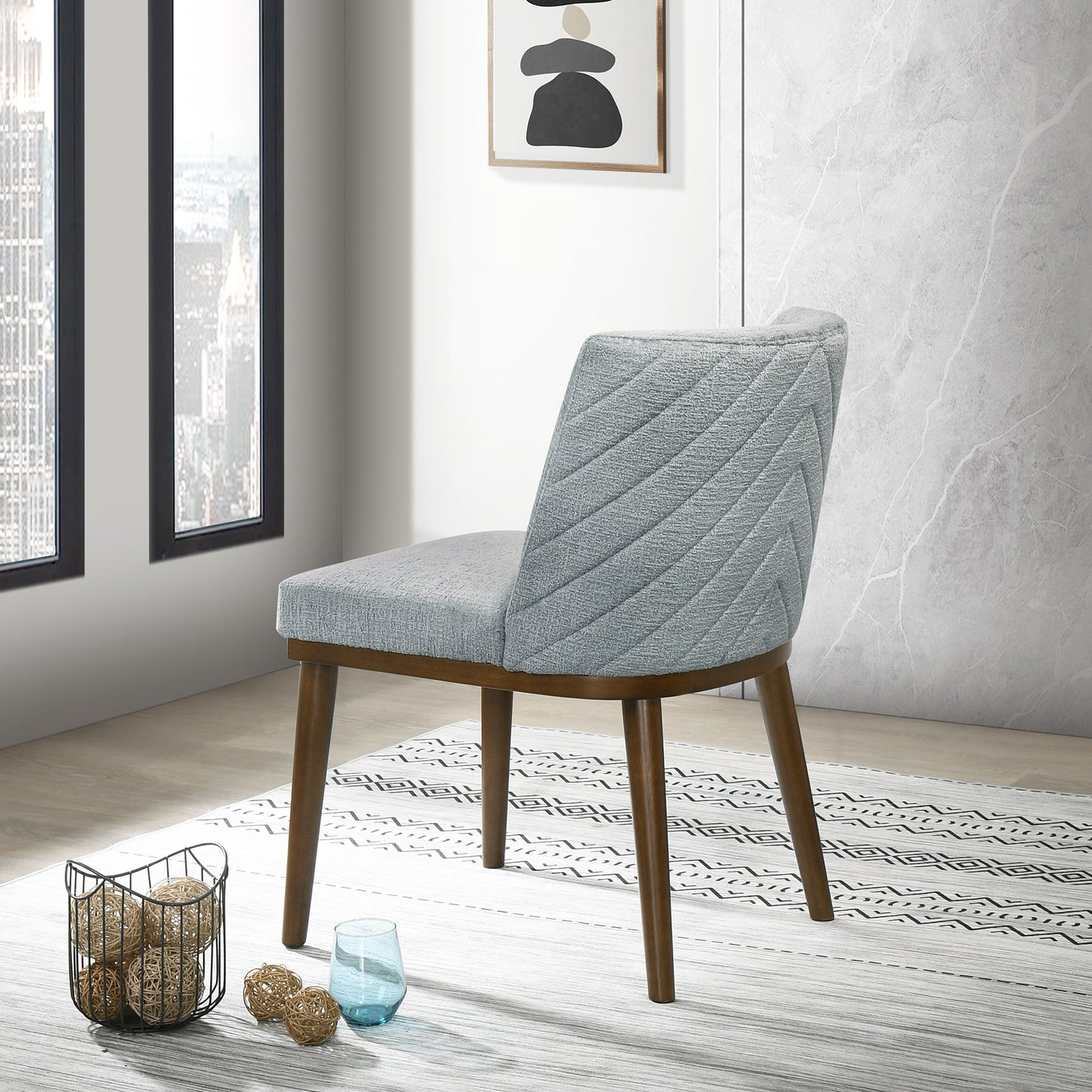 Midcentury modern grey upholstered dining chair with quilted chevron pattern