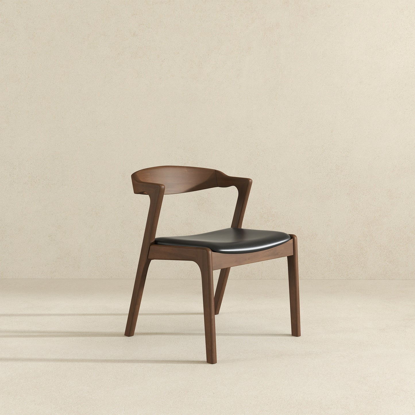 Modern walnut dining chair with black leather seat for contemporary interiors