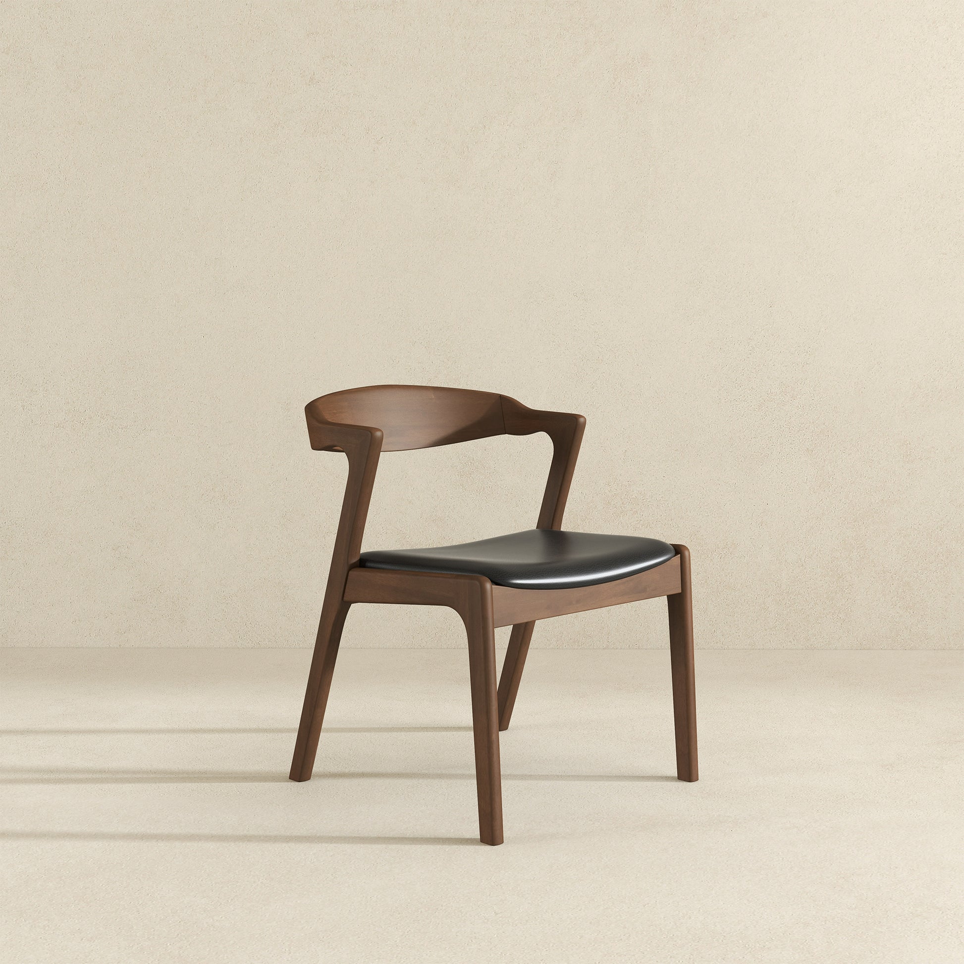 Modern walnut dining chair with black leather seat for contemporary interiors