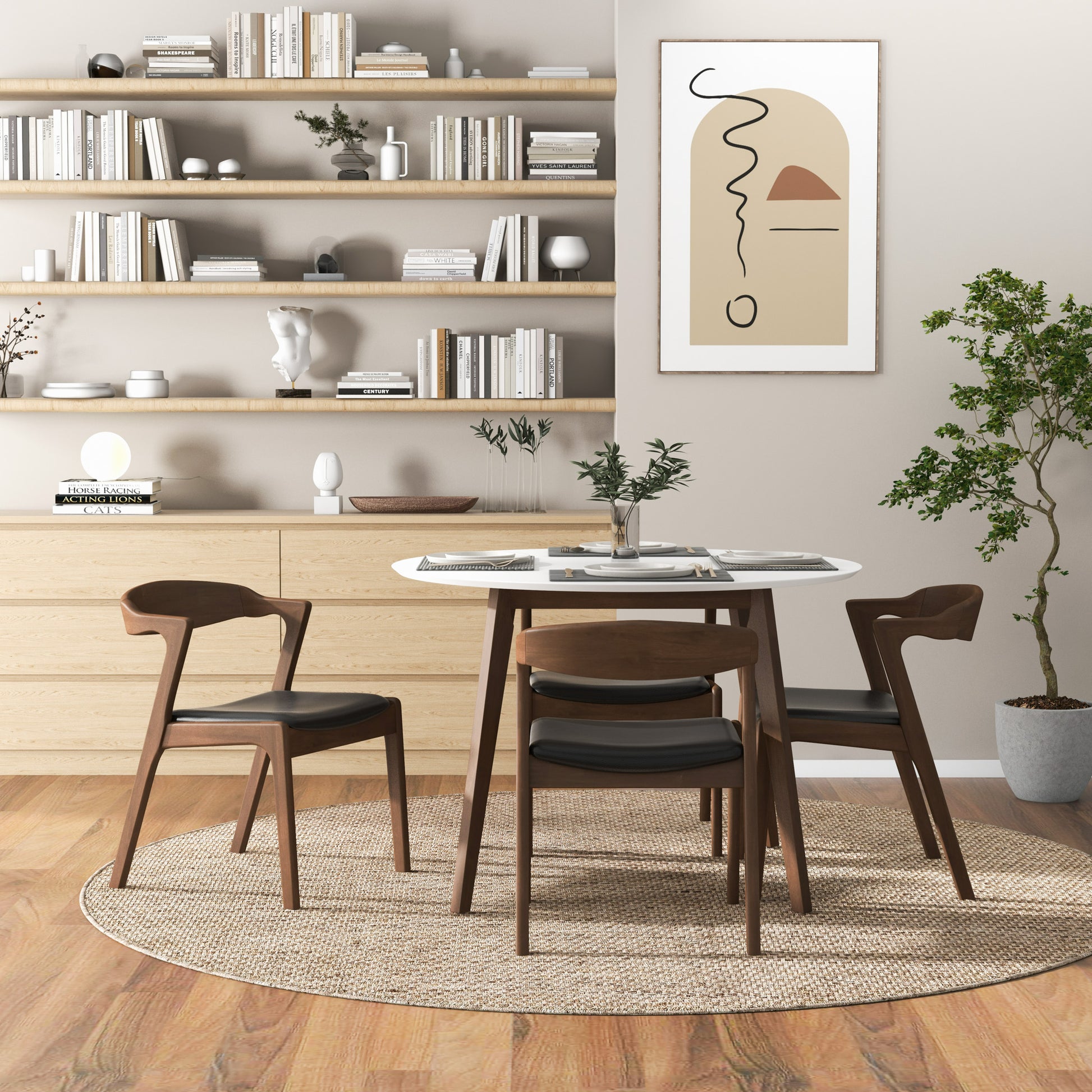 Wooden dining chairs with black upholstered seats around a white round table