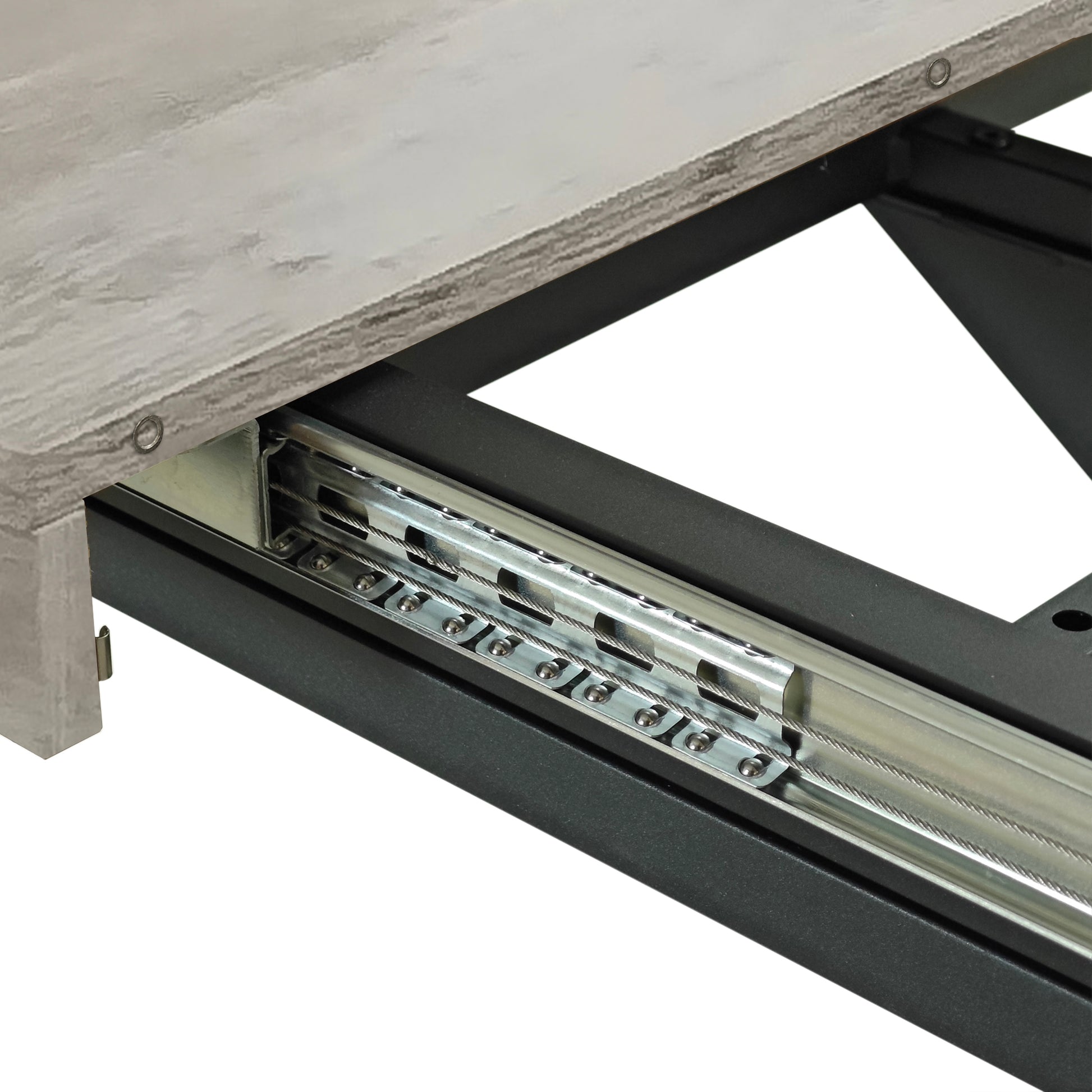 Closeup of extension table mechanism with smooth metal glides and cable support system