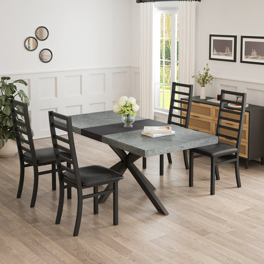Modern rectangular dining table with dark grey stonelook top and black metal base seating four chairs