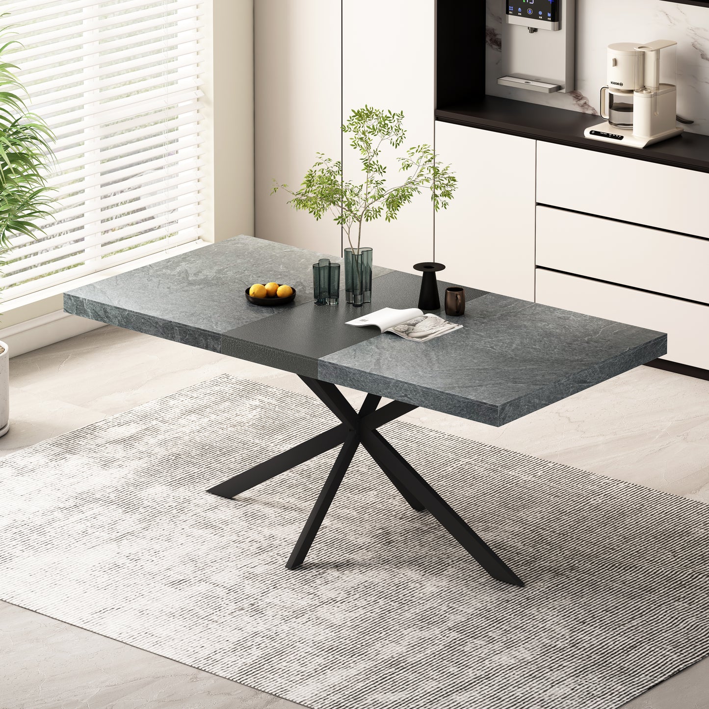 Modern dining table with a grey stonelook top and sleek black metal legs