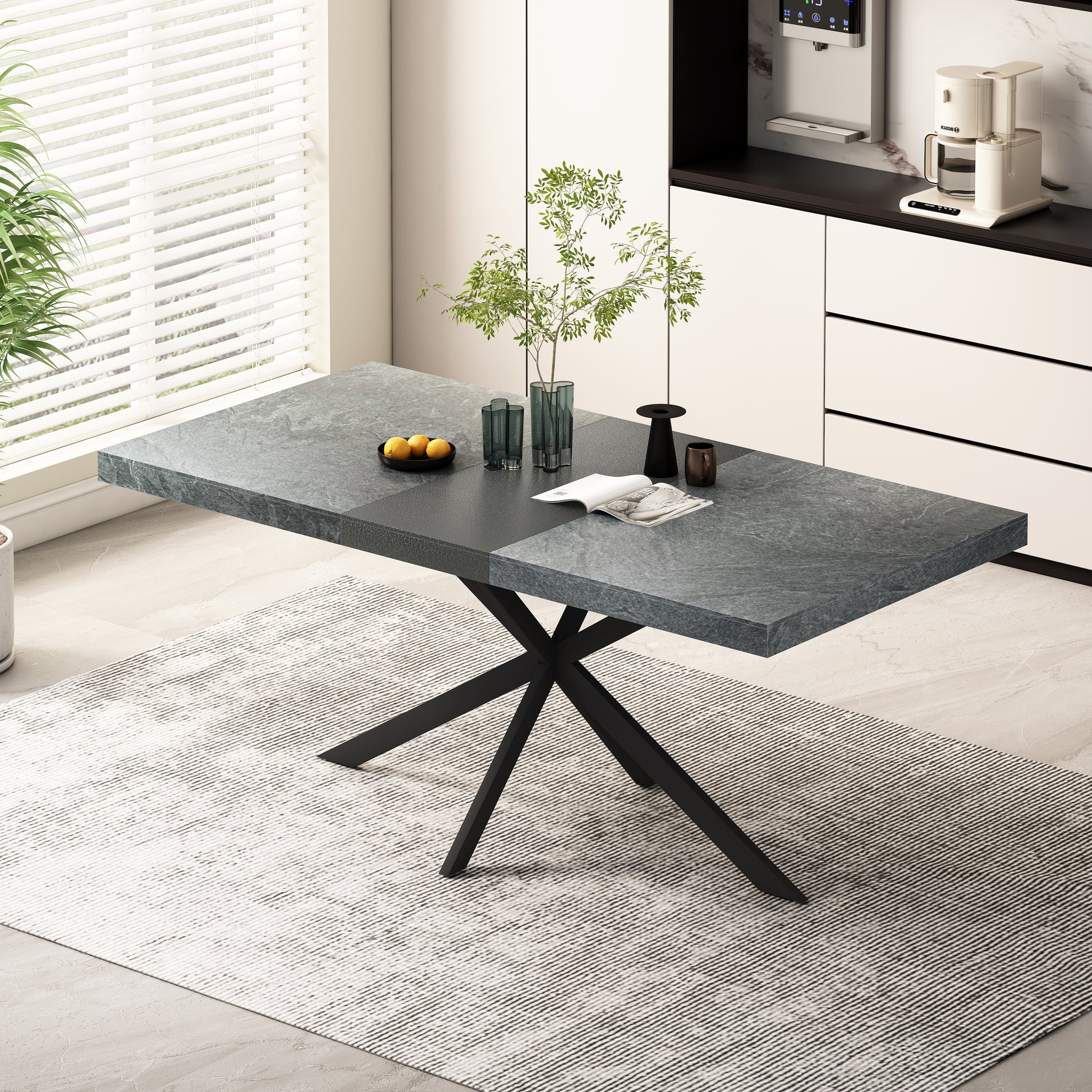 Modern dining table with a grey stonelook top and sleek black metal legs