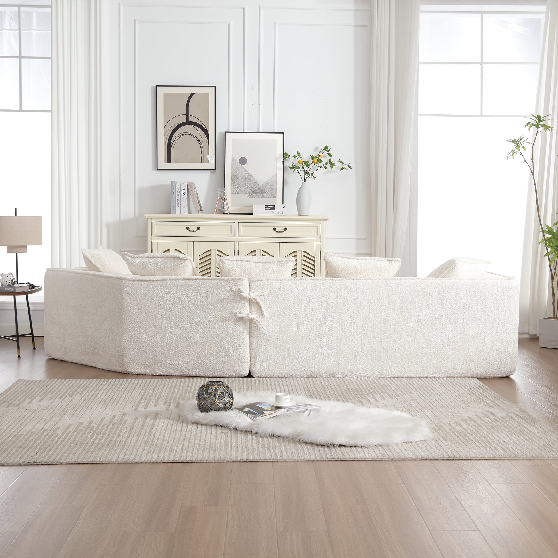 Plush cream boucle fabric sectional sofa with decorative tie details perfect for modern living rooms