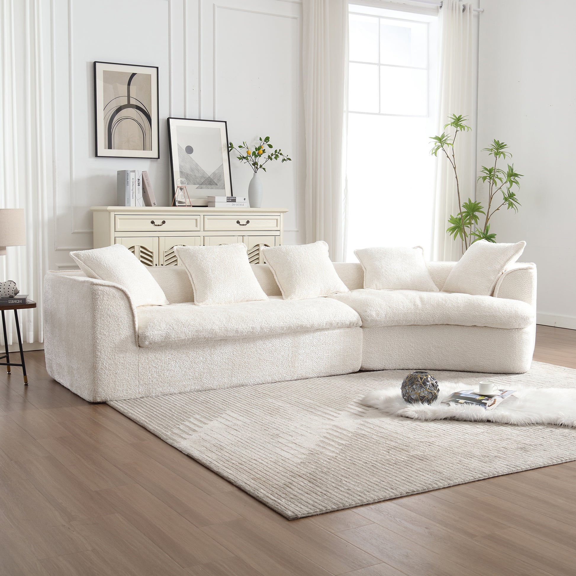 Cozy offwhite boucle sectional sofa with plush throw pillows for a comfortable living room arrangement