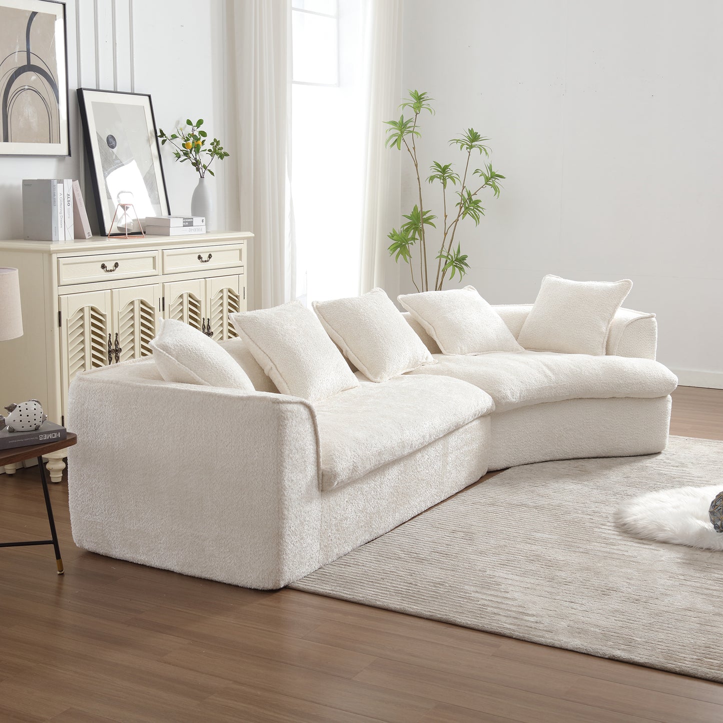 Plush cream boucl sectional sofa with deep cushions and a curved chaise lounge for ultimate comfort