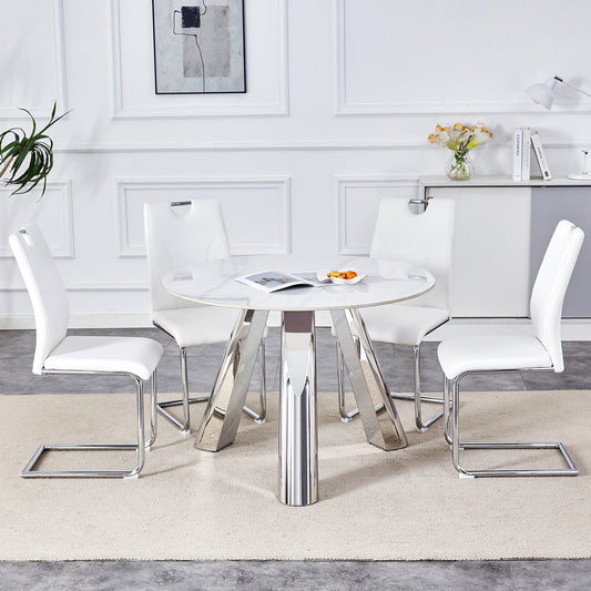 White marble dining table with chrome legs and four white faux leather chairs