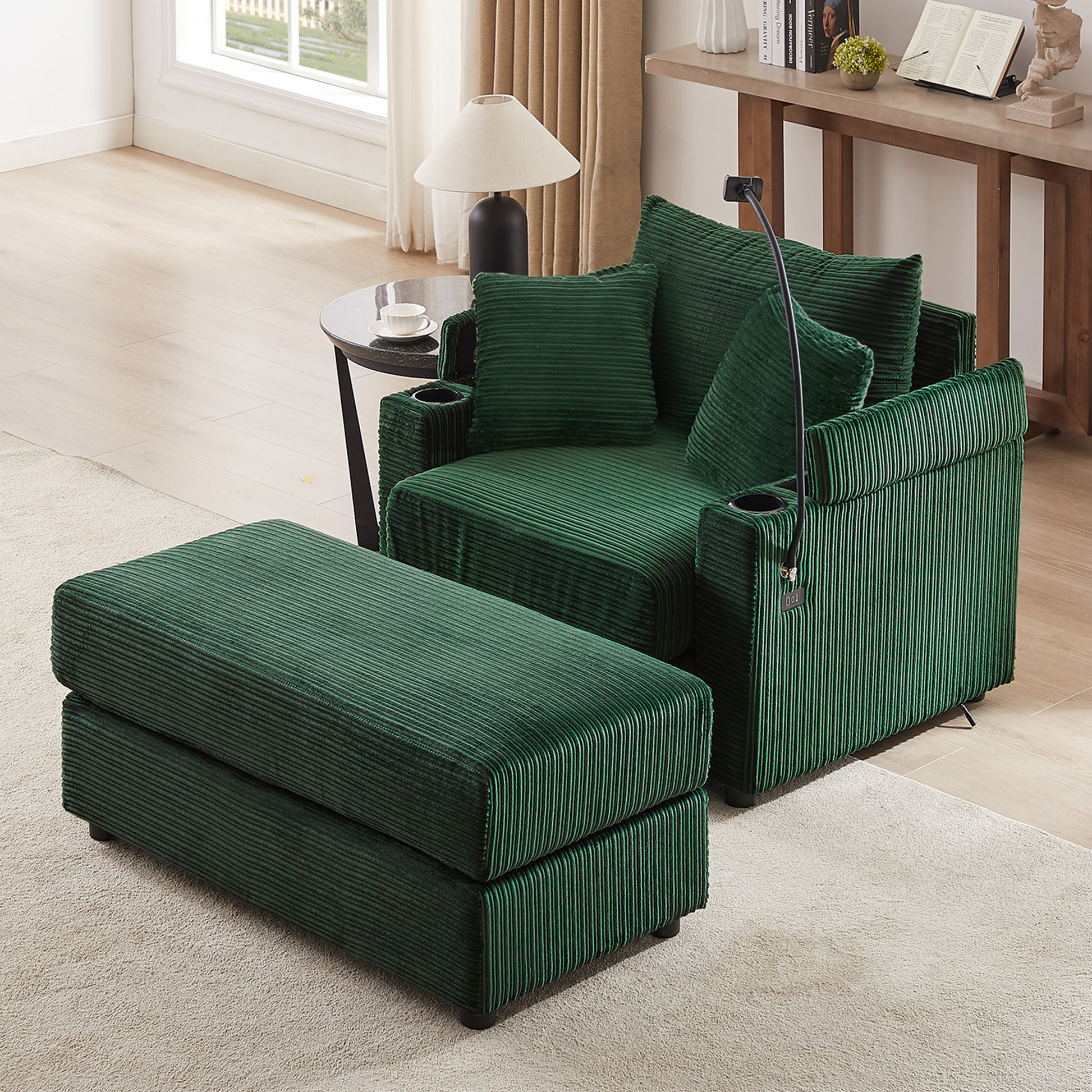 Deep green corduroy armchair with ottoman and matching accent pillows