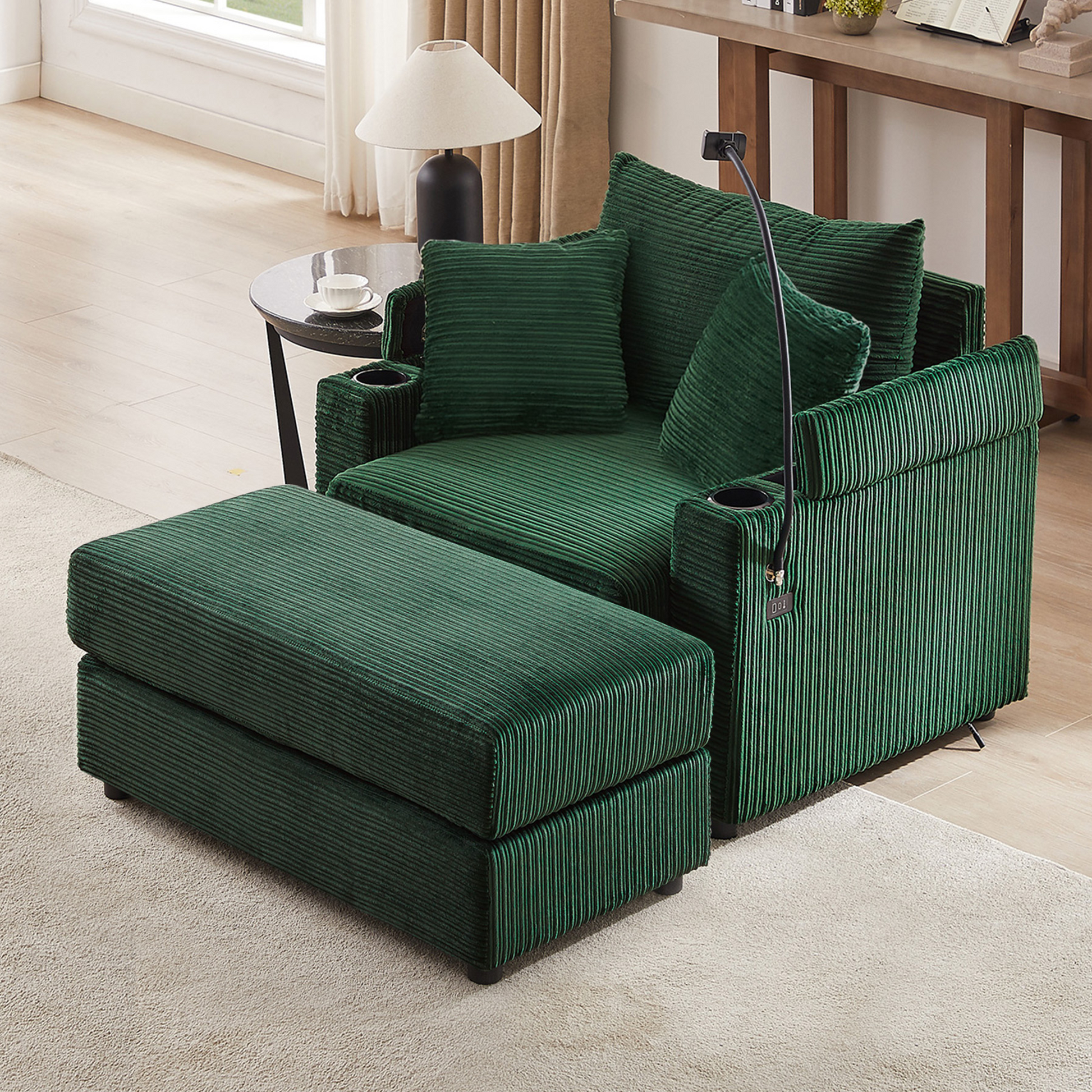 Deep green corduroy accent chair with ottoman featuring builtin cup holders and USB charger