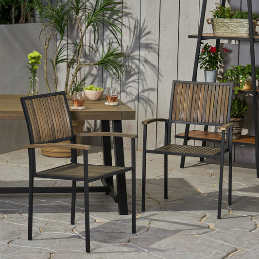 Two black metal outdoor chairs with slatted wood seats and backs