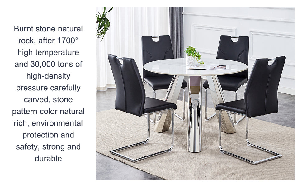 Black faux leather dining chairs with chrome legs around a white round dining table