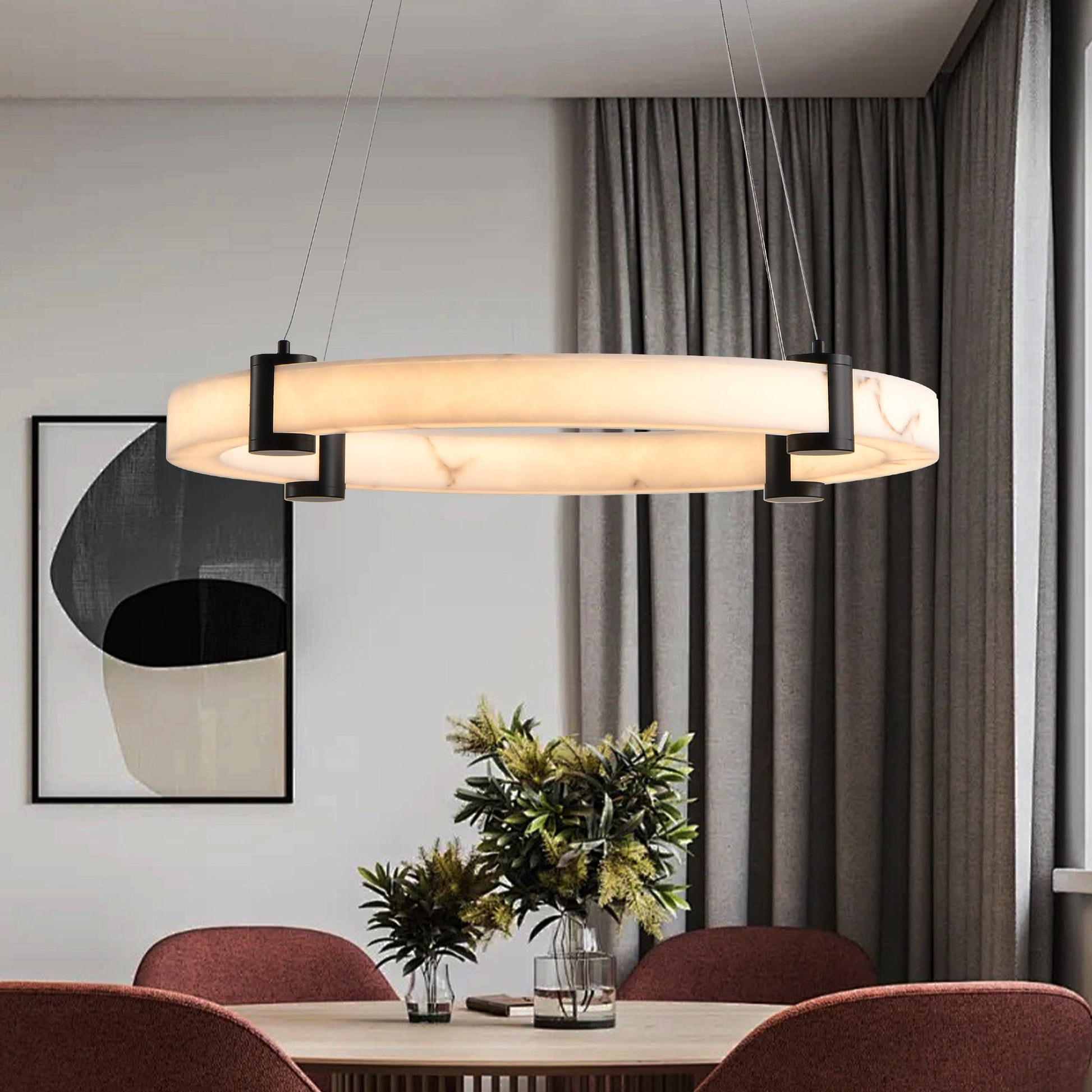 Modern circular LED chandelier with a white marble effect diffuser and black accents perfect for dining rooms