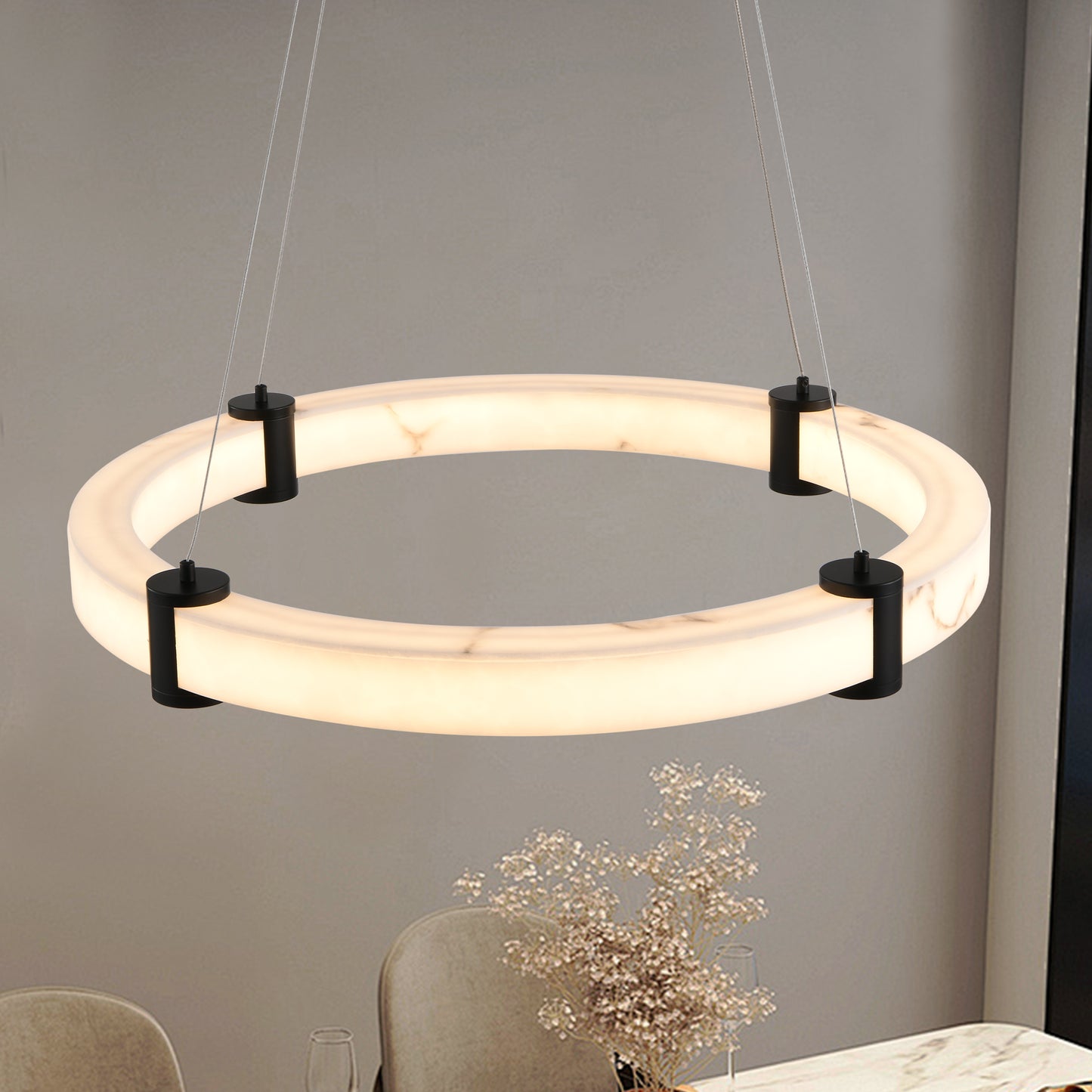 Modern circular pendant light with white marble accents and black hardware